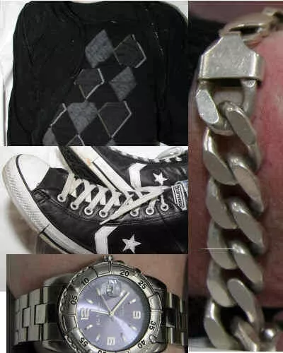 Een uitsnede van een zilverkleurige schakelarmband en bijpassende ketting, vergelijkbaar met de sieraden die de ongeïdentificeerde man droeg.